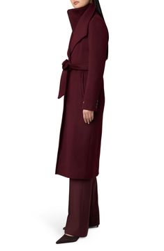 An inset bib panel that detaches dials up the warmth and versatility of this longline coat cut from a sumptuous wool blend. 46" length Front button closure; inset zip closure Drape collar; inset stand collar Button cuffs Front welt pockets Removable tie belt Back vent Lined 55% wool, 40% polyester, 5% other fibers Dry clean Imported Long Belted Wool Outerwear, Luxury Women's Belted Wool Coat, Luxury Long Belted Wool Coat, Luxury Fitted A-line Wool Coat, Luxury Long Sleeve Wool Coat With Double-breasted Button, Burgundy Cardigan, School Wear, Longline Coat, Platform Slippers