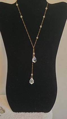 This lovely true vintage lariat necklace can be adjusted to wear one long/short or evenly on your neck.  It has a gold colored paperclip chain, and what's great about this piece is that it has a few crystals along the chain.  It measures approx 21" end to end.  I purchased this from an antique dealer about 30 years ago and have really enjoyed it; now it's time for someone else to enjoy. Vintage Lariat Jewelry, Formal Long Drop Chain Necklace, Elegant Lariat Necklace With Paperclip Chain, Elegant Wire Wrapped Lariat Jewelry, Elegant Handmade Lariat Drop Necklace, Elegant Adjustable Wire-wrapped Lariat Necklace, Elegant Handmade Lariat Chain Necklace, Elegant Adjustable Wire Wrapped Lariat Necklace, Wire Wrapped Lariat Jewelry