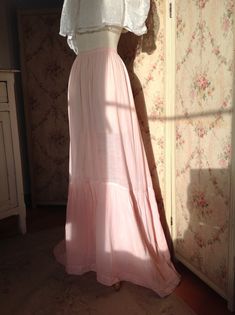 "soft, flowing skirt like the belle epoque period this skirt is made of a silk cotton blend , and that's why it is so soft and flowing the color is pink with a peach tone waist 55 cm 21 3/4\" front length 106 cm 41 1/2\" back length 118 cm 46 1/2\" I saw some threads outside coming from the seam ans a tiny little spot. This skirt is in excellent condition" Pink Flowy Skirt For Daywear, Pink Long Skirt For Daywear, Pink Maxi Length Ruffled Skirt, Pink Ruffled Maxi Length Skirt, Pink Ruffled Skirt For Daywear, Pink Maxi Dress With Lined Skirt, Vintage Long Dress With Lined Skirt, Vintage Long Skirt Dress With Lined Skirt, Vintage Flowy Ruffled Maxi Skirt