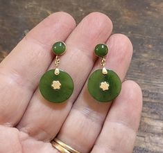 Here's a great antique or vintage pair of genuine Jadeite earrings in 14 karat rose gold. The warm color of the gold is wonderfully complemented by the rich green of the Jade. At 1 and 1/8 inches long, these earrings are perfect for every day or a night on the town! The Jade discs at the bottom are about 15 mm diameter, and over 2 mm thick. These hang on little chains from bezel set 6mm Jade cabochons. All the Jade is perfect, well matched, and original. These earrings are in fabulous original condition and come complete and ready to wear with 14 karat gold friction backs. With lots and of swing and sway, these unusual earrings are sure to garner compliments! ~ These will arrive at your house Gift Boxed, ready to giftwrap or wear! ~ You can also follow me on Instagram for first looks at ne Vintage Jade Round Earrings, Yellow Gold Pierced Jade Jewelry, Vintage 14k Gold Earrings With Polished Finish, Yellow Gold Jade Earrings For Anniversary, Antique Polished Finish Earrings As Gift, Antique Polished Earrings For Gift, Antique Polished Earrings As Gift, Fire Agate Ring, House Gift Box