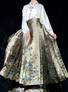 Golden and opalescent brocades bring a scene of mountains, rivers, and poetry to life. A traditional Mamian Qun 马面裙 (horse face skirts), with traditional calligraphy running up and down the length of the skirt. Ethereal, regal, and a versatile skirt to pair with every top you own! A popular skirt originating from the Ming Dynasty, this A-line skirt is not only comfortable, but flattering on every body type. Choose a traditional color like red or black, or opt for the contemporary slate gray - pe Mamian Skirt, Cultural Clothes, Traditional Calligraphy, Modern Hanfu, Classic Skirts, Horse Face, New Chinese Style, Ming Dynasty, Long Skirts