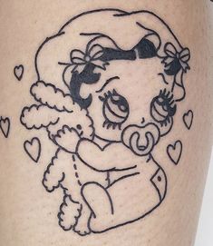 a tattoo on the leg of a woman with a teddy bear