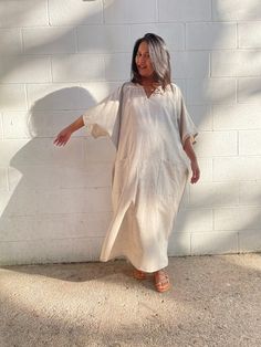 Flow in total comfort with our light cotton kaftan. This kaftan is perfect for the beach, pool, resort and laid-back time at home. Crafted from quality soft and light 100% cotton, it offers an airy fit that's ideal for lounging and out and about. Its relaxed design and easy slip-on style make it your go-to choice for outdoor happenings and relaxed nights at home. Relaxed Fit Vacation Cover-up, Relaxed Fit Beach Dress, Neutral Cotton Beach Dress, Beachwear Kaftan With Short Sleeves In Relaxed Fit, Beachwear Kaftan With Short Sleeve And Relaxed Fit, Short Sleeve Relaxed Fit Kaftan For Beachwear, Beachwear Style Kaftan With Short Sleeves, Summer Cotton Tunic For Loungewear, Relaxed Cotton Beach Dress