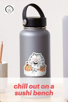 a water bottle with a cat sticker on it