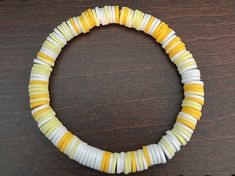 Handmade Yellow and White Clay Bead Bracelet. There are two shades of Yellow mixed with White. White Clay Bead Bracelet, Clay Bead Bracelet, Clay Bead, White Clay, Shades Of Yellow, Clay Beads, Bead Bracelet, Jewelry Bracelets, Beaded Bracelets