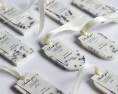 wedding favors with ribbons and tags on them