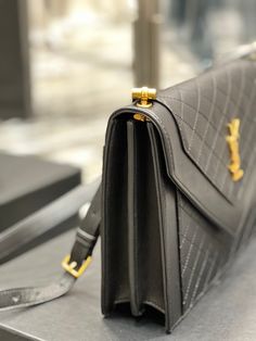 Description S.L Gaby Satchel Bag In Black With Gold Toned Hardware For Women 10.2in/26cm 6688631EL071000 Rep 1:1 Size: 26 x 18 x 5 cm / 10.2 X 7 X 2 inches Black Snap Closure Small compartment Gold-toned metal hardware Gaby Satchel with a front flap Include dust bag. This product is of the best quality. The production time is 3-5 working day. You’ll received the parcel within 14-17 business days. Yves Saint Laurent Bags, Saint Laurent Bag, Gold Tone Metal, Satchel Bags, Contact Us, Yves Saint Laurent, Fashion Bags, Paper Bag, Clutch Bag