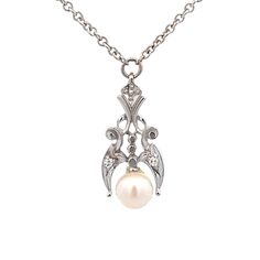 "A pearl and diamond pendant. Set at the bottom of the pendant is a round pearl. Prong set with (2) single cut diamond accents. The pendant has a geometric design. The pendant if fixed in the center of a 15\" long cable chain with spring ring closure. Metal Content Guaranteed 14k white gold Weight: 4.3 grams Stone Information Type: Cultured Pearl 5.5-6mm in diameter Type: Diamond (2) Cut: Single Cut Carat Total Weight (Calculated): 0.028cttw Color/Clarity: H-I / SI average Measurements of pendan Diamond Pendant Set, Art Nouveau Necklaces, Bridal Shower Gift, June Birthstone, June Birth Stone, Bridal Shower Gifts, Diamond Art, Pendant Set, Cultured Pearls