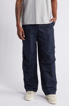 A loose fit and double-articulated knees bring hardworking comfort to pants made of soft cotton with a drawstring at the waist and a pair of extraroomy pockets. 31" inseam; 20" leg opening; 13" front rise; 17" back rise (size Medium) Elastic/drawstring waist Front patch pockets 100% cotton Machine wash, tumble dry Imported Utility Style Relaxed Fit Sweatpants With Drawstring, Utility Style Sweatpants With Drawstring, Utility Style Sweatpants With Drawstring And Relaxed Fit, Utility Sweatpants With Drawstring And Relaxed Fit, Utility Bottoms With Functional Drawstring For Outdoor, Utility Bottoms With Functional Drawstring For Outdoor Activities, Sports Parachute Pants With Pockets And Straight Leg, Straight Leg Parachute Pants For Sports, Casual Sports Pants With Functional Drawstring