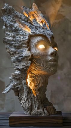 a close up of a statue with fire coming out of it's eyes and head