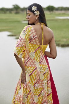 Yellow attached cancan lehenga with abstract placement print. Paired with pearl embroidered padded blouse and geometric print dupatta.
Components: 3
Pattern: Printed
Type Of Work: Abstract
Neckline: Halter neck
Sleeve Type: Sleeveless
Fabric: Taffeta
Color: Yellow
Other Details: 
Length:
Blouse: 14 inches
Lehenga: 45 inches
Model height: 5ft 8inches, wearing size S
Disclaimer: This product is exclusively hand crafted using multiple techniques, individually handled at different stages, any irregu Designer Wear Lehenga With Traditional Drape For Summer, Summer Festive Lehenga With Traditional Drape, Summer Lehenga With Resham Embroidery In Traditional Drape, Summer Designer Lehenga Semi-stitched, Summer Designer Semi-stitched Lehenga, Traditional Drape Lehenga With Resham Embroidery For Summer, Summer Semi-stitched Lehenga, Summer Semi-stitched Pre-draped Saree For Designer Wear, Traditional Drape Summer Dress With Pallu