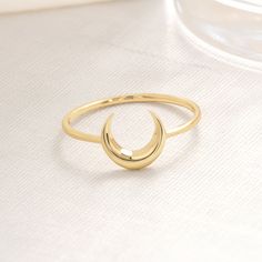 "Unique and dainty 14K solid gold (real & filled) moon personalized & custom ring can be best gifts for her (women, mom, mother, girlfriend, bridesmaid) Minimalist style handmade chunky,stacking and chevron crescent moon jewelry use as an engagement, promise, mothers day, wedding gift. 𝐓𝐡𝐞 𝐩𝐫𝐨𝐝𝐮𝐜𝐭 𝐢𝐧 𝐭𝐡𝐞 𝐢𝐦𝐚𝐠𝐞 𝐢𝐬 𝟏𝟒𝐤 𝐠𝐨𝐥𝐝, 𝐰𝐞 𝐡𝐚𝐯𝐞 𝟏𝟎𝐤 𝐨𝐩𝐭𝐢𝐨𝐧𝐬. Please carefully choose your ring size from the options menu during checkout! These items in our shop are handcrafted and made to order. Jewelry Details Band:14K Solid Gold Carat:585 There are 585 stamps in our rings. We are making Free Custom Engraving. Please type your engraving information in the \"Add your personalization\" box! Model Ring Size: The ring size on the model is 7 US. Items are shown large Adjustable Gold Midi Rings With Moon Shape, Dainty Moon-shaped Gold Ring, Adjustable Gold Moon Midi Rings, Minimalist Crescent Moon Charm Ring, Minimalist Adjustable Crescent Ring, Dainty Moon-shaped Midi Rings As Gift, Dainty Moon-shaped Midi Promise Rings, Gold Minimalist Rings With Moon Phase, Dainty Crescent Gold Rings