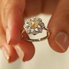 Sometimes when a girl says she likes to receive flowers as a gift, it's not the real flowers she means. Think twice and go for the safest thing - our Flora ring with Golden Rutile Ring with Moissanite. Floral jewelry is where it's at! Perfect as a graduation gift, birthday gift, anniversary ring, or a promise ring. Det Spiritual Rose Cut Diamond Rings As Gift, Flower Ring With Rose Cut Diamonds For Gifts, Diamond Flower Ring With Birthstone As A Gift, Promise Flower Ring With Rose Cut Diamonds, Rose Cut Diamond Flower Promise Ring, Diamond Flower Ring With Birthstone For Anniversary, Promise Rose Cut Diamond Flower Ring, White Gold Flower Ring With Birthstone For Wedding, Sterling Silver Rings With Rose Cut Diamonds For Proposal