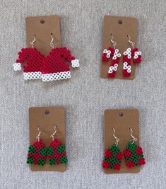 four pieces of christmas themed beaded earrings