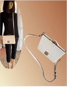 "White leather hand bag/cross body.  Fairly rigid, the strap is removable and it turns into a clutch. Framed in silver with a silver logo in front. Lift clasp.  Inside, a zipped pocket on one side, two one pockets on the other. In the middle a zipper slider. Elegant and practical. Four silver little rivets on the bottom to hold the bag up. Only thing.. Not very roomy... Width 3\" Length 9\" Height 6\" Catherine Malandrino, French fashion designer." White Satchel With Silver-tone Hardware For Formal Occasions, White Formal Satchel With Silver-tone Hardware, Versatile White Formal Shoulder Bag, Elegant White Satchel With Silver-tone Hardware, White Satchel With Detachable Handle Shaped As A Clutch, Versatile White Satchel With Detachable Handle, White Satchel With Detachable Handle, Silver Crossbody Satchel With Top Carry Handle, White Clutch Bags With Silver-tone Hardware