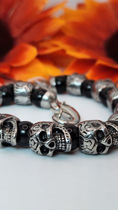 Skull Bracelet!  -Stainless steel (hypoallergenic)  -Black beads separate each skull 💀  -12 skull beads and 13 black beads  -Large lobster style clasp  -9 inches total length  Bracelet can be shortened before shipping! Gothic Stainless Steel Skull Bracelets, Black Gothic Skull Bracelet, Black Skull Punk Bracelets, Punk Black Skull Bracelets, Black Gothic Bracelets With Skull Print, Halloween Skull Bracelets With Skull Print, Adjustable Gothic Bracelets With Skull Print, Silver Skull Print Bracelets As A Gift, Gothic Skull Print Bracelets As Gift