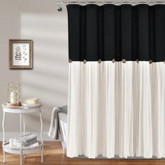 a black and white shower curtain in a bathroom