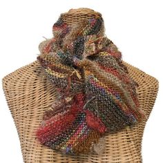 This diagonally knit woman's scarf is a boho style in a brown color way of boutique yarns. It is five inches wide and 53 inches long. Completely reversible, this scarf is hand knitted in Buttermilk Cottage's own boutique yarn, FUSION, a collection of a dozen or more different yarns, colors and textures.  When knitted it creates a unique texture and color way. Colors are predominately different shades of brown, but you will also see some teal, hot pink, orange and green.  I have also included some eyelash and metallic.  "Tails,"  where the different yarns have been added have been left for extra fun and embellishment!   Please note colors often appear different on a variety of monitors. Hand wash, cold water.  Lay flat to dry or dry clean. This item is knitted and ready to ship! Buttermilk Orange And Green, Pink Orange, Boho Style, Womens Scarves, Brown Color, Lay Flat, Scarf Wrap, Hand Knitting, Boho Fashion