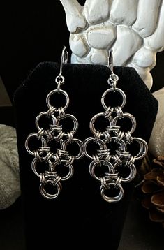 A beautiful handmade chainmaille earring in the form of a floral pattern.   Made with stainless steel jump rings and a clasp back surgical steel earring hook. Nickel Free Silver Metal Flower Earrings, Handmade Silver Drop Cluster Earrings, Nickel-free Silver Metal Flower Earrings, Silver Metal Flower Earrings With Ear Wire, Silver Flower Earrings With Ear Wire, Consumer Board, Jump Ring Earrings, Chainmail Earrings, Chainmaille Earrings