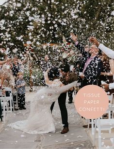 a bride and groom are showered with confetti