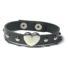 Soft Studded Black  Heart Leather Bracelet  -  Silver Round Studs - 10mm Black Leather Wristband  This black leather wristband is 10mm wide and about 8 inches long.   It can fit a wrist 6 inches around.  The strap is made of handcut soft cowhide Genuine leather.                                                       It have added a silver heart slide charm in the center with 5 mm Silver Round Studs evenly spaced on both sides. I have added 2 silver snap button closures on the ends to make sure it Black Leather Cuff Bracelet, Background Simple, Leather Heart, Punk Accessories, Black Leather Bracelet, Leather Wristbands, Goth Jewelry, Buckle Bracelet, Studded Belt