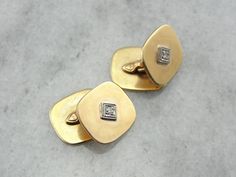 These cufflinks, circa 1940, are the very definition of sophistication. The soft yellow gold cushion shapes radiate with a warm and inviting luster. The cuff links are decorated with a diamond illusion center crafted from 14 karat white gold, giving the diamonds the perfect backdrop to sparkle. Metal: 14 Karat Yellow Gold Gem: 2 Diamonds totaling 0.05 carat Measures: 15 mm x 13 mm Cushion SKU #: 1AU61T-N At the time of sale our jewelry is shipped with a certificate of authentication and/or an ap Cushion Shapes, Gold Cushions, Gold Cufflinks, Soft Yellow, Cuff Links, White Gold Diamonds, Gold Diamond, Cufflinks, Diamonds