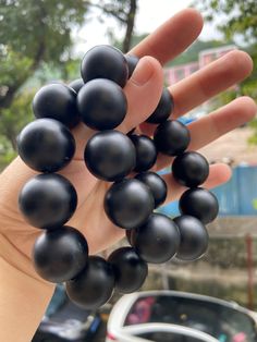 Material:Black onyx beads  size :20mm quantity: one strand  6mm approx 29 pcs one strands 7mm approx25 pcs one strands 8mm approx 22 pcs one strands 9mm approx 21pcs one strands 10mm approx 19 pcs one strands 11mm approx 18pcs one strands 12mm approx 16 pcs one strands 13mm approx 16 pcs one strands 14mm approx 15 pcs one strands 15mm approx 14pcs one strands 16mm approx 14 pcs one strands 17mm approx 13pcs one strands 18mm approx 13pcs one strands 19mm approx 12pcs one strands 20mm approx 12pcs Obsidian Beaded Bracelets With Black Beads, Polished Onyx Beaded Bracelets, Black Onyx Round Beads Bracelets, Polished Onyx Round Beads Bracelet, Black Gemstone Round Beads, Black Bracelets With Large Beads For Gift, Black Bracelets With Large Beads As Gift, Black Round Gemstone Beads, Black Round Jewelry With Large Beads