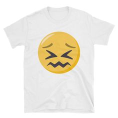 a white t - shirt with an emoticive smiley face