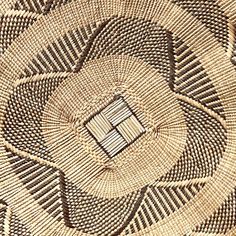 a close up view of a woven basket with an open square in the center and lines on it