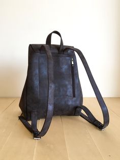 "This bag is made of high quality vegan leather in dark brown. It is very soft and lightweight but durable. It has a rustic, distressed look. It has one interior and one exterior zipper pocket. Straps are adjustable. It is suitable for both men and women. There is two size option: Small : 17 x 27 x 30 cm Large : 20 x 30 x 36 cm IMPORTANT! Your orders between 7-25 August will be shipped on August 28. Delivery takes 2-5 days to the US, Canada, Australia and Europe; in 3-7 days to rest of the world Brown Faux Leather Rectangular Backpack, Brown Rectangular Faux Leather Backpack, Brown Faux Leather Standard Backpack, Versatile Brown Leather Backpack, Versatile Brown Leather Backpack For Daily Use, Brown Faux Leather Backpack For On-the-go, Brown Faux Leather Backpack For Everyday Use, Rectangular Faux Leather Backpack For Daily Use, Versatile Faux Leather Backpack For Daily Use