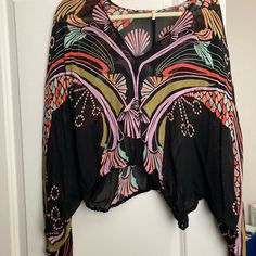 Never Worn, Free People Blouse. Cinched Waist And Sleeves. Beautiful Colors, Sheer. Black Long Sleeve Top With Abstract Print, Black Long Sleeve Tops With Abstract Print, Bohemian V-neck Blouse With Graphic Print, Black V-neck Printed Blouse, Abstract Print Long Sleeve Tops For Day Out, Black Long Sleeve Top With Boho Print, V-neck Graphic Print Beach Blouse, Black Bohemian Printed Blouse, Black Boho Print Tops For Spring