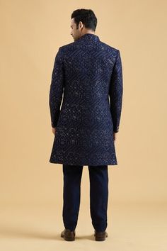 Navy blue sherwani featuring floral thread embroidery all over highlighted with sequin. Paired with a solid kurta and a pant. - Aza Fashions Blue Sherwani With Dori Work In Traditional Drape, Indigo Traditional Wear With Resham Embroidery For Wedding, Blue Sherwani With Dori Work, Fitted Indigo Salwar Kameez For Diwali, Fitted Indigo Kurta For Navratri, Indigo Bollywood Traditional Wear For Wedding, Bollywood Style Indigo Traditional Wear For Wedding, Indigo Traditional Wear For Wedding And Festivals, Embroidered Indigo Traditional Wear For Wedding