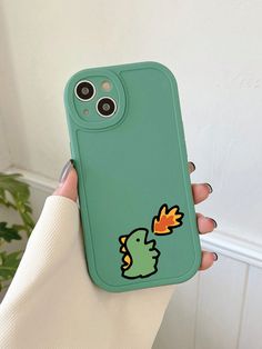 a person holding up a phone case with an image of a bird on the back