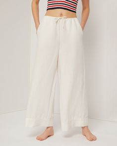 White Linen Bottoms With Elastic Waistband For Lounging, Loungewear Bottoms With Tie Waist And Straight Leg, Solid Color Wide Leg Pants For Spring Lounging, Solid Wide Leg Pants For Spring Lounging, Straight Leg Pants With Tie Waist For Loungewear, Chic Linen Wide Leg Pants With Drawstring, Relaxed Fit Wide Leg Bottoms With Drawstring, Chic Wide Leg Pants With Drawstring In Relaxed Fit, Chic Wide Leg Pants With Drawstring And Relaxed Fit