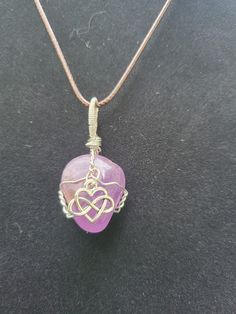 "Wire wrapped Amethyst with Infinity Heart charm with 20\" adjustablewaxedcottoncordnecklace. Please note this stone is much more purple than it appears in picture, it is not pink at all" Adjustable Amethyst Crystal Necklace As Gift, Adjustable Amethyst Crystal Necklace For Gift, Adjustable Purple Jewelry With Heart Charm, Adjustable Heart-shaped Wire Wrapped Necklace, Adjustable Hand-wrapped Amethyst Crystal Necklace, Adjustable Hand Wrapped Heart Jewelry, Adjustable Purple Necklaces With Heart Beads, Purple Jewelry With Adjustable Cord As Gift, Purple Jewelry With Adjustable Cord For Gift