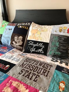 a bed topped with lots of pillows covered in different types of t - shirt designs