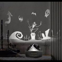 a halloween scene is projected on the wall