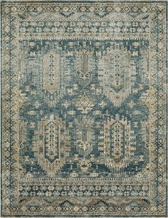 an area rug with blue and beige colors