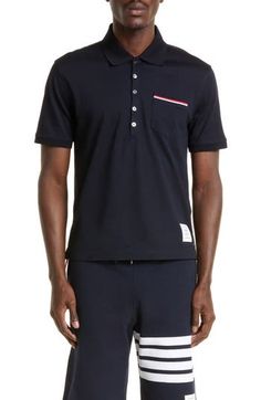 A tipped chest pocket and button-down side vents add sporty sophistication to a pique polo in soft mercerized cotton. 26" front length (size 2) Five-button placket Short sleeves Chest pocket Step hem with button side vents 100% cotton Dry clean or hand wash, dry flat Made in Japan Men's Designer Navy Man, Polo Shirt White, Grey Shirt, Polo Collar, Thom Browne, Button Placket, Chest Pocket, Made In Japan, Short Sleeve Shirt