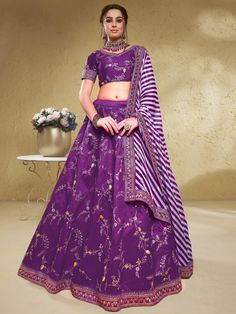 Make everyone's head turn with the enchanting purple embroidered silk wedding lehenga choli with dupatta. This stunning ensemble is crafted from high-quality art silk material, featuring a rich purple color that exudes elegance and sophistication. The lehenga showcases exquisite thread embroidered work, adding a touch of intricate detail to the overall design.
The set includes a matching choli, also made from a similar color art silk material, with thread embroidered work that perfectly compleme Purple Embroidered Semi-stitched Dupatta, Purple Floor-length Traditional Wear For Navratri, Fitted Purple Embroidered Fabric For Eid, Semi-stitched Embroidered Fabric For Reception In Purple, Semi-stitched Embroidered Fabric For Reception, Purple, Fitted Purple Embroidered Fabric For Reception, Purple Embroidered Saree Fabric For Reception, Purple Saree With Intricate Embroidery For Reception, Purple Anarkali Embroidered Fabric For Festive Season