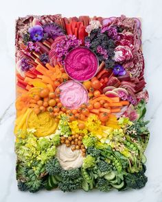 an art work made out of vegetables and fruits