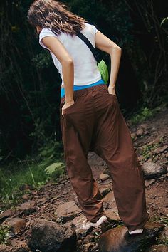 Hike on in these durable, water-resistant pants, featuring a slightly barrel-legged silhouette and easy-access doubled front pockets. **Fit:** Relaxed fit; barrel leg; high-rise **Features:** 100% Nylon fabrication; water-resistant; durable; drawstring adjustable waistband; snap closure fly; doubled front pockets; drop in back pockets; hits just above ankle **Why We | Well Played Pants by FP Movement at Free People, Argon Oil, XS Baggy Wide-leg Parachute Pants For Outdoor Activities, Utility Baggy Bottoms For Outdoor, Baggy Utility Bottoms For Outdoor, Straight Leg Hiking Pants With Pockets, Hiking Straight Leg Pants With Pockets, Outdoor Pants With Functional Pockets, Outdoor Parachute Pants With Side Pockets And Wide Leg, Outdoor Loose-fit Cargo Pants With Pockets, Baggy Parachute Pants With Side Pockets For Outdoor