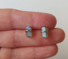 These simple, dainty stud earrings are so versatile, and will compliment just about any outfit! The genuine carved Labradorite stones are hand wrapped with 22 gauge stainless steel wire so they won't tarnish. Earrings will come on an earring card with plastic earring backs. All my jewelry is handmade, and made with patience, care and love. In the unlikely event that it needs to be repaired, I'll do it free of charge. Wire Wrapped Cartilage Earrings As Gift, Minimalist Wire Wrapped Crystal Earrings As Gift, Minimalist Crystal Earrings As Gift, Minimalist Nickel-free Crystal Earrings Gift, Raw Quartz Crystal, Emerald Earrings Studs, Plastic Earrings, Raw Quartz, Dainty Studs