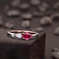 a close up of a ring on top of a rock