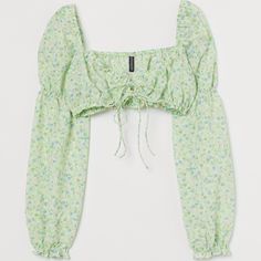 H&M Light Green Floral Crop Top Size Xs New With Tags Gathered, Extra-Short Crop Top In Woven Fabric. Narrow, Concealed Elastic At Top And At Hem. Gentle V-Neck At Front With Ties, Long, Voluminous Sleeves With Smocked Seams At Upper Arms, And Concealed Elastic At Shoulders And Cuffs. Size Xs Material Content Polyester 98%, Spandex 2% Smoke Free Home Cropped Polo Shirt, Royal Blue Lace, Purple Crop Top, Boho Crop Tops, Satin Crop Top, Graphic Crop Top, Womens Halter Tops, Sequin Crop Top, Bralette Crop Top