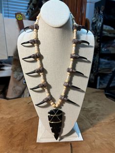 Replica eagle claw necklace with hand knapped obsidian heavy serrated point, resin claws, bone beads Handmade Black Claw Jewelry, Unique Hand Tooled Black Jewelry, Julien Bam, 300 Win Mag, Powwow Regalia, Wasteland Weekend, Claw Necklace, Eagle Claw, Bone Necklace