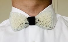 Resin Bow tie for men and women. This bow tie is made from resin with beads inserted inside. The bow tie is pre-tied and adjustable so that it fits all sizes.  * Please note bow ties may slightly vary from picture as they are a handmade-product and not factory made, therefore unique and individual. White Bow Tie For Gifts, White Bow Tie Gift, Classic White Bow With Butterfly Knot, White Formal Bow Tie With Butterfly Knot, Formal White Bow Tie With Butterfly Knot, Adjustable White Bow Tie With Butterfly Knot, White Bow Tie For Black Tie Events, White Dapper Bow Tie For Wedding, Dapper White Bow Tie For Wedding