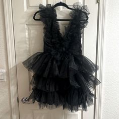 Besides Trying On, This Beautiful Dress Has Never Been Worn (Not Taller People Friendly. I Am 5’7” And Did Not Cover Enough Bottom) Chic Black Dress For Dress-up, Chic Ruffled Mini Dress For Costume Party, Black Ruffled Mini Dress For Costume Party, Fitted Ruffle Mini Dress For Dress-up Occasions, Fitted Mini Dress With Ruffles For Dress-up Events, Fitted Ruffle Mini Dress For Dress-up, Black V-neck Dress For Costume Party, Tulle Mini Dress, Tall People