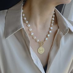 Experience the timeless beauty and elegance of our Baroque natural freshwater pearl necklace. Handcrafted from the finest pearls, each necklace is unique, with its own one-of-a-kind shape and luster. Add a touch of sophistication to any outfit with this luxurious and versatile piece.

Natural freshwater pearl
Pearl diameter:6mm
Pendant diameter:2.2cm
Weight about: 63g
Chain length: 40 CM (+ 5 cm adjustable chain)
Adjustable lobster clasp size - one size fits all
High quality zinc alloy
Hypoaller Freshwater Pearl Necklace, Freshwater Pearl Necklaces, Chain Lengths, Chain Length, Timeless Beauty, One Size Fits All, Zinc Alloy, Lobster Clasp, Fresh Water