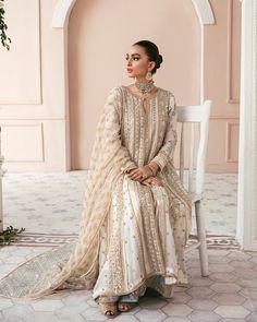 Buy Embellished Sharara Kameez Pakistani Wedding Dress, adorned with embroidery work, stones, sequins, motifs, and adda work. Custom sizes. Fast shipping. White And Gold Pakistani Dress, Floor-length Lawn Suit With Zari Work For Reception, Floor-length Embroidered Lawn Suit For Wedding, Embroidered Floor-length Lawn Suit For Reception, Floor-length Wedding Lawn Suit With Intricate Embroidery, Organza Sharara With Dabka Work For Wedding, Floor-length Lawn Suit With Dupatta For Reception, Bollywood Style Lawn Suit With Zari Work For Reception, Bollywood Style Jamawar Wedding Dress